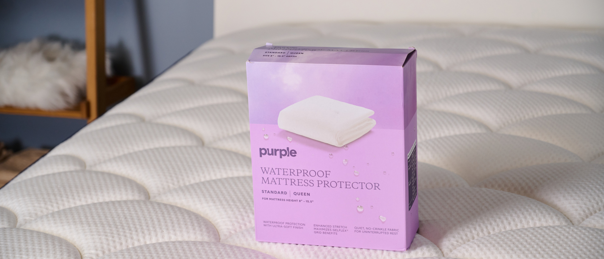 Purple Waterproof Mattress Protector boxed up and kept on the bed