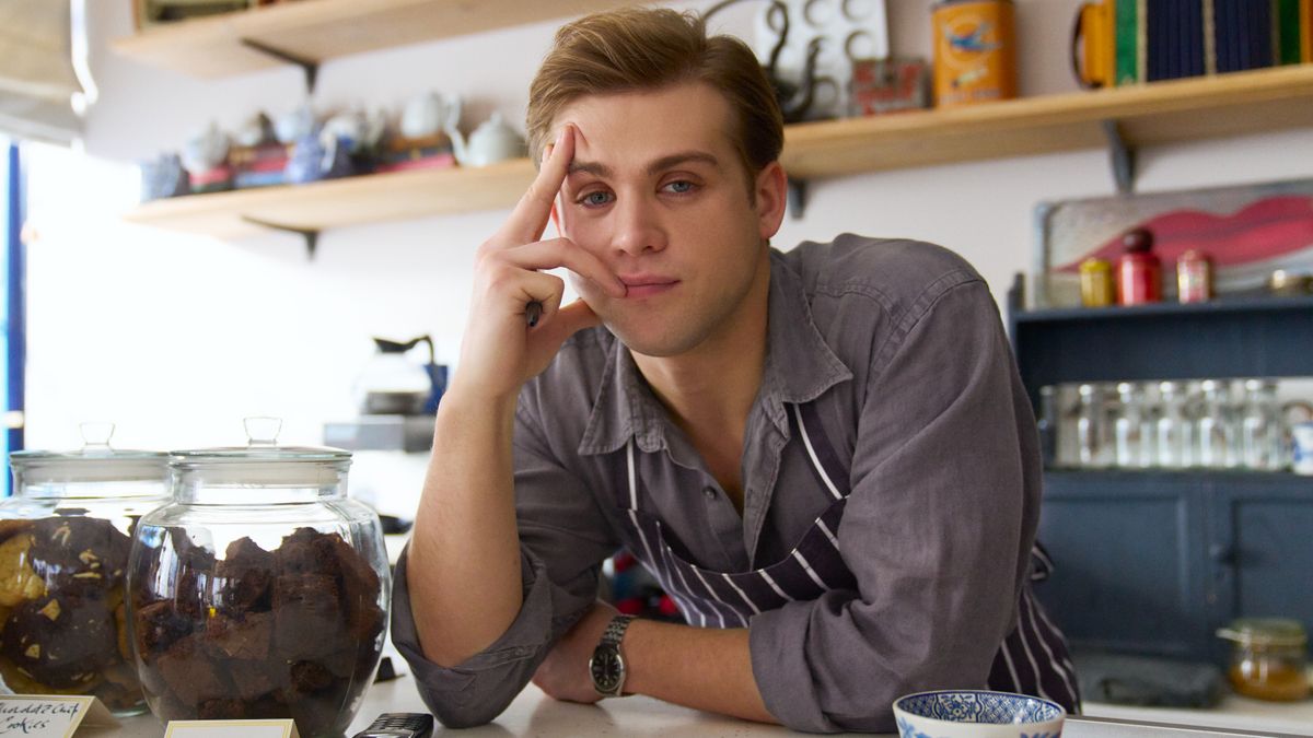 Dexter leaning on the cafe counter.