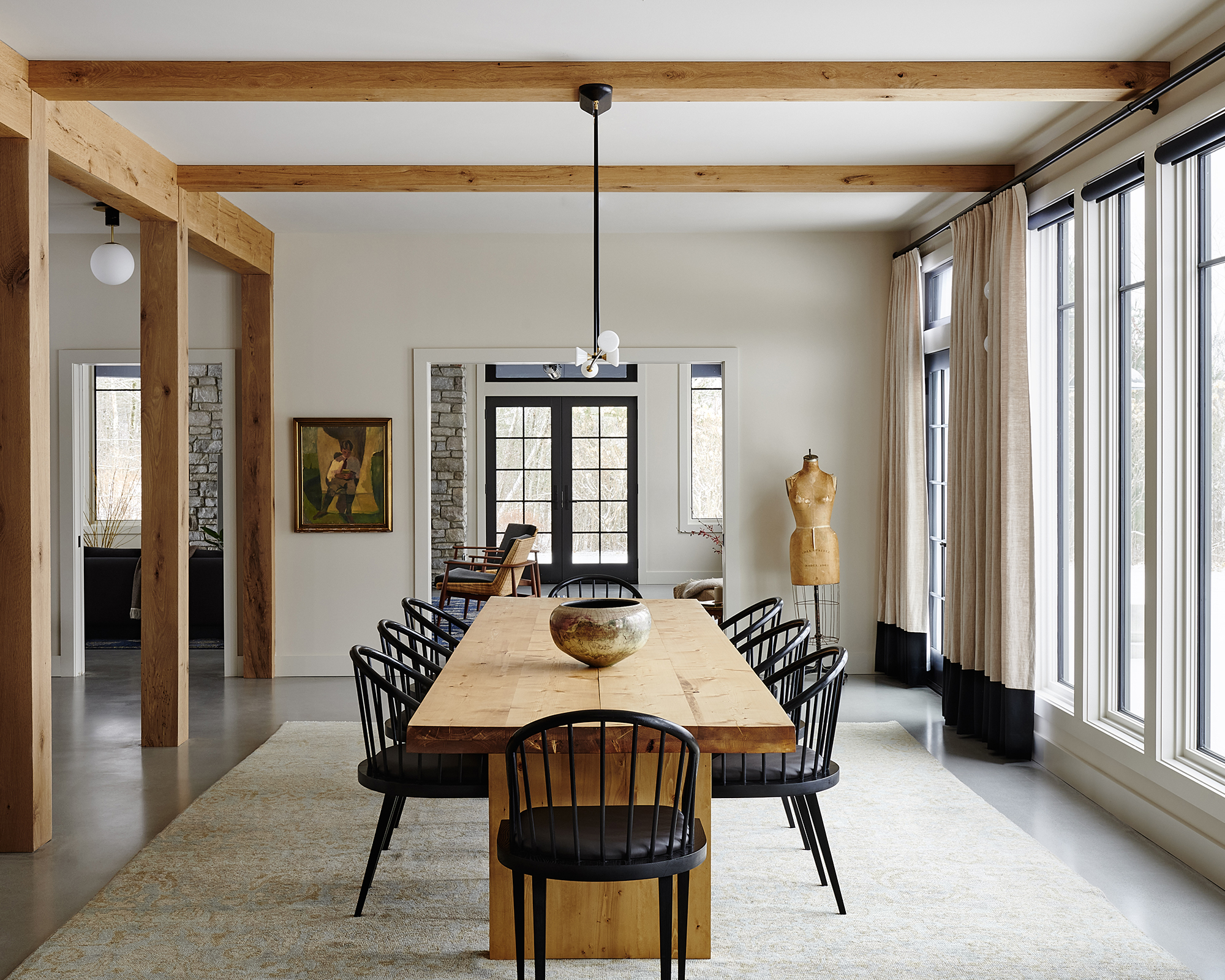 dining room with wood table and black chairs