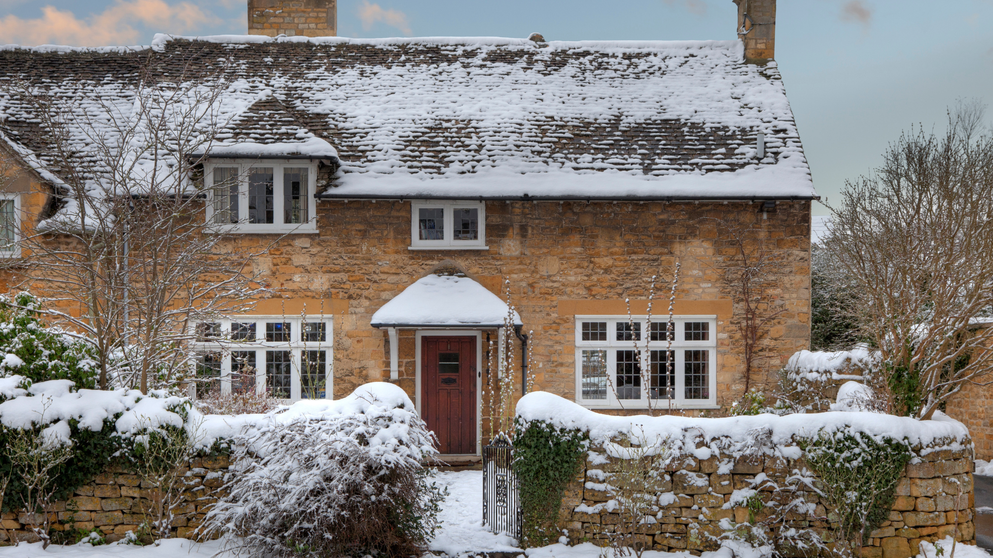 cottage with snow on it