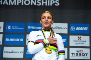 Cat Ferguson wearing a rainbow jersey