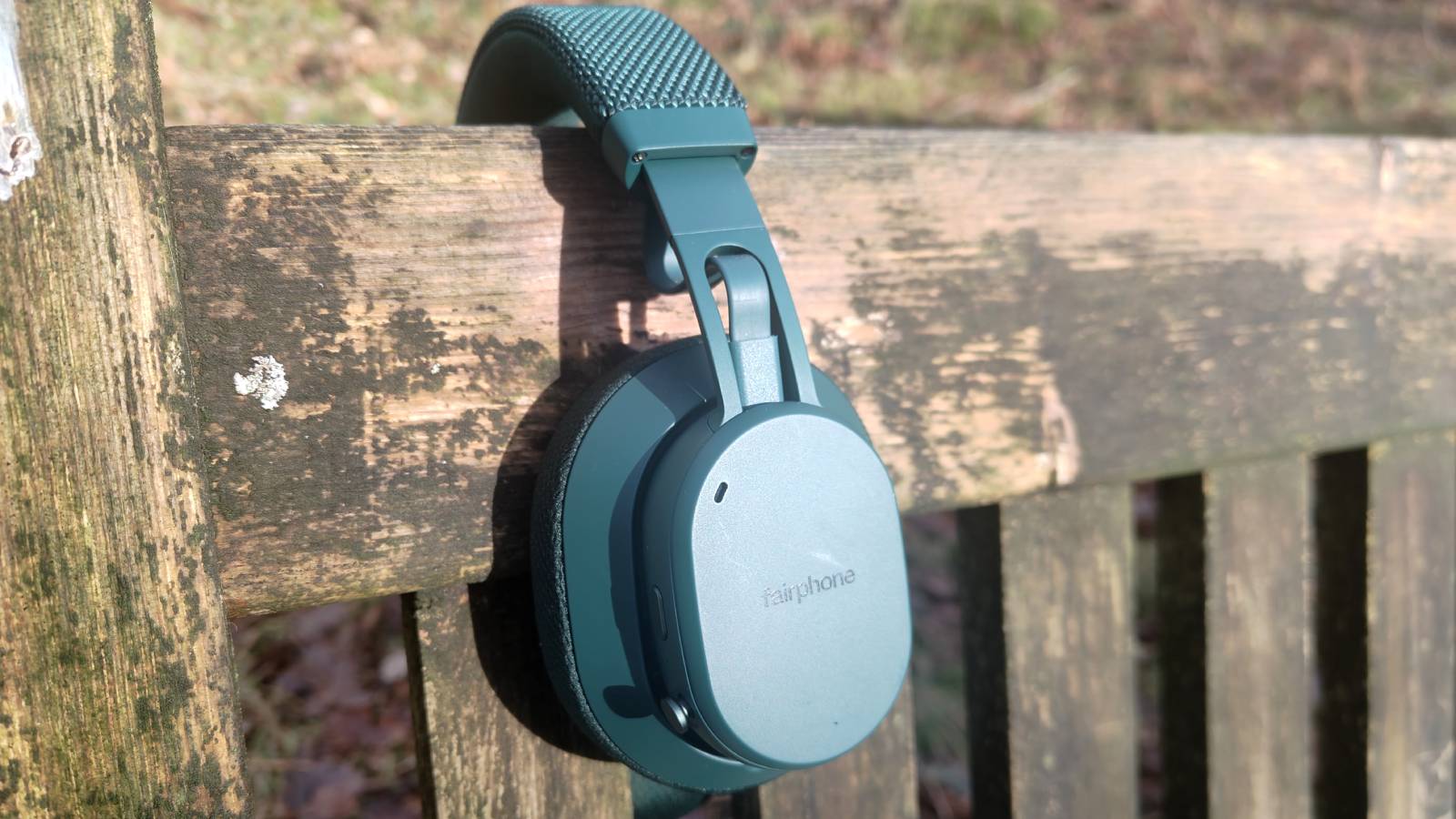 The Fairphone Fairbuds XL 2025 on a bench.