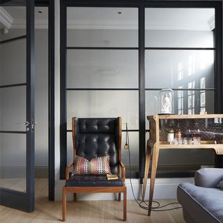 room with glass door and chair