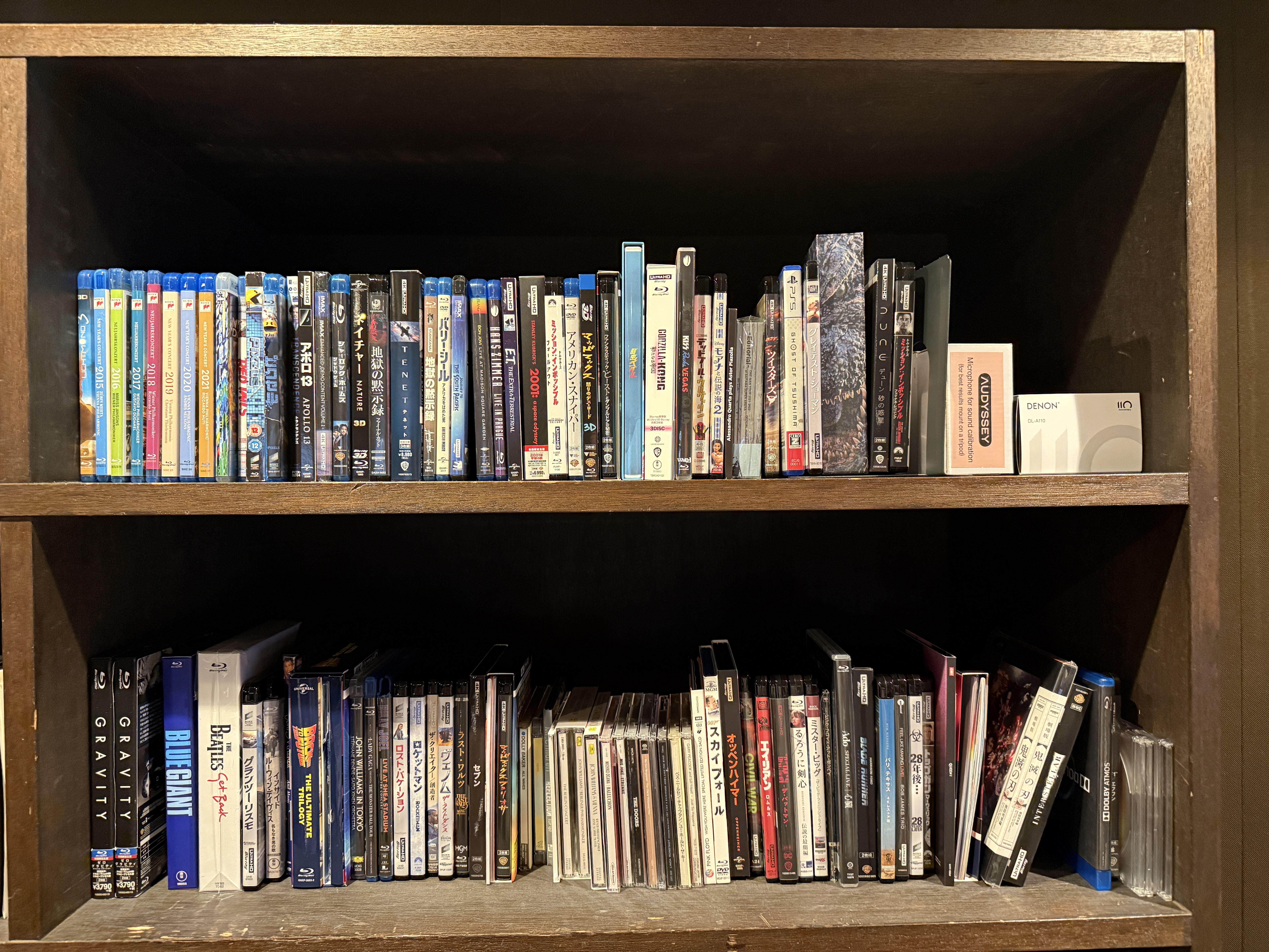 Two shelves full of Blu-ray discs (and some CDs and DVDs)