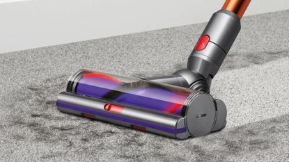The Dyson Cyclone V10 Absolute cleaning hair on a rug