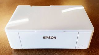 Epson PictureMate PM-400 Wireless Photo Printer being tested in writer's home