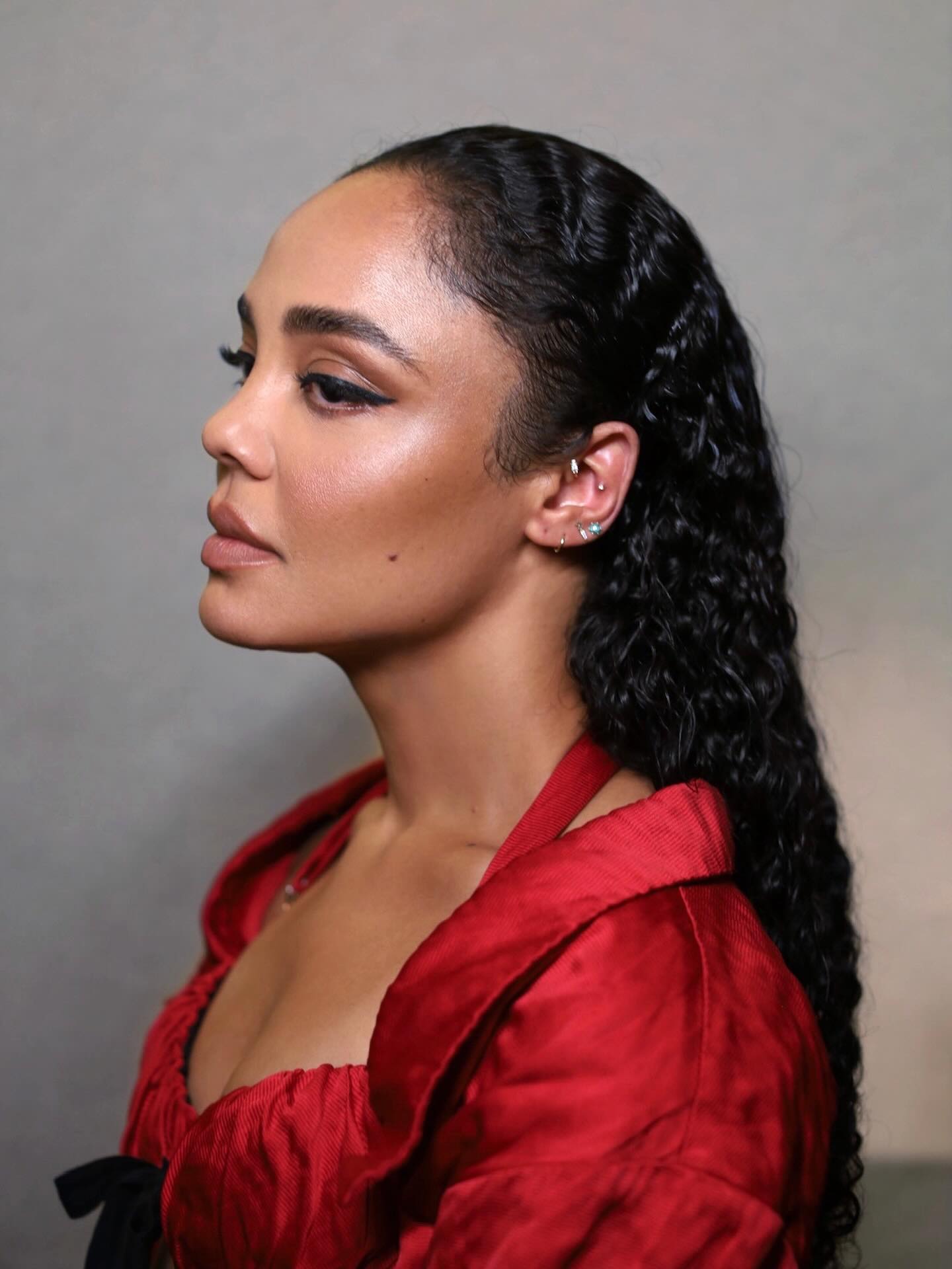Tessa Thompson with slicked back curls