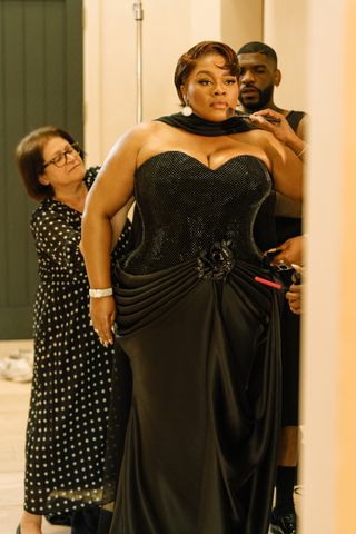 Da'Vine Joy Randolph looks in the mirror preparing for the 2025 Oscars in a Tamara Ralph dress