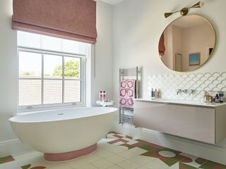 Geometric, tiled floor with hints of green and pink and pink blind