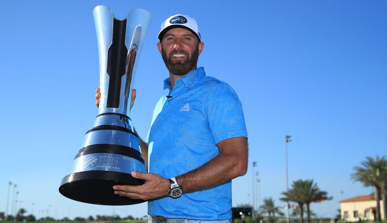 Johnson holds the trophy