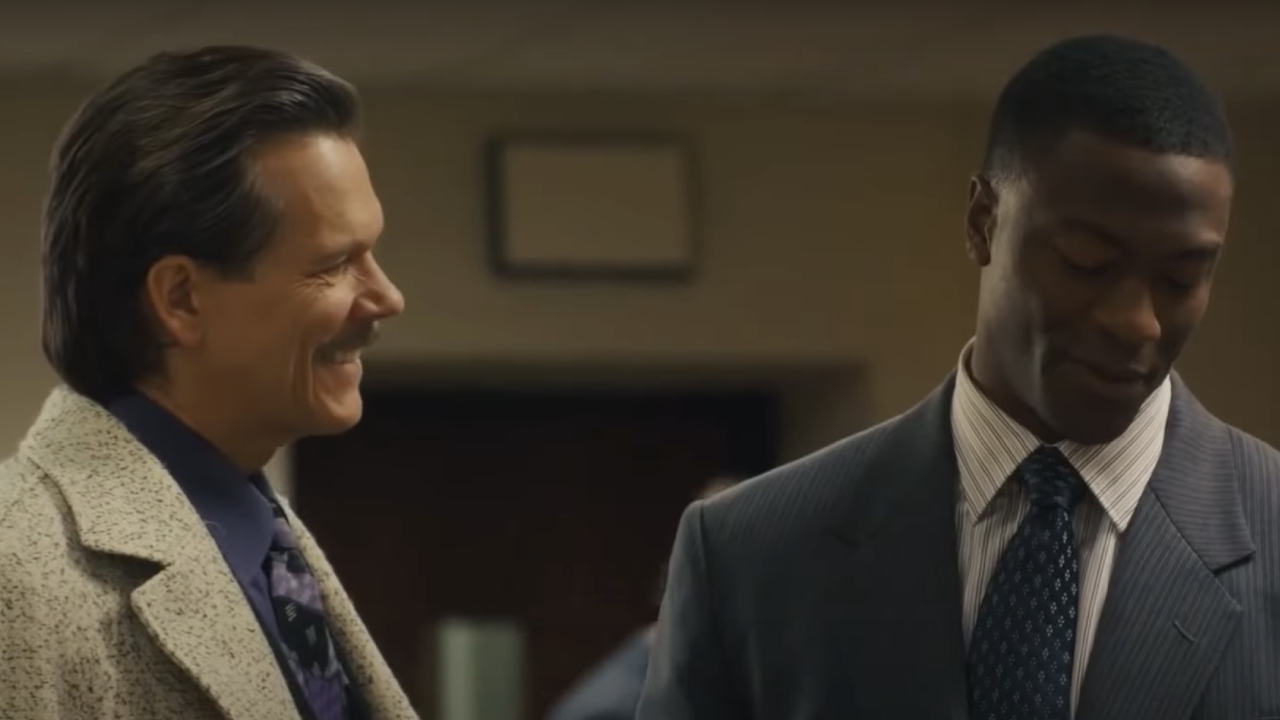 Kevin Bacon smiling at Aldis Hodge on City on a Hill