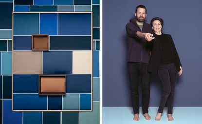 Blue block artwork & two people posing