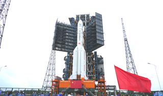 A Chinese Long March 5 rocket carrying the Chang'e 5 moon sample-return spacecraft rolls out to the launch pad at the Wenchang Satellite Launch Site on Hainan Island on Nov. 17, 2020.