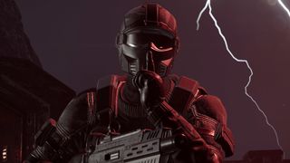 A Helldivers making a hushing gesture while wearing a Redacted Regiment armor set.