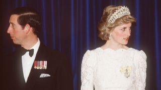 Prince Charles, Prince of Wales and Diana, Princess of Wales, wearing a white Murray Arbeid dress and Queen Mary;s diamond and pearl tiara, attend a dinner