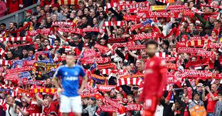 Liverpool fans show their support prior to the Premier League match between Liverpool and Everton at Anfield on April 24, 2022 in Liverpool, England. 
