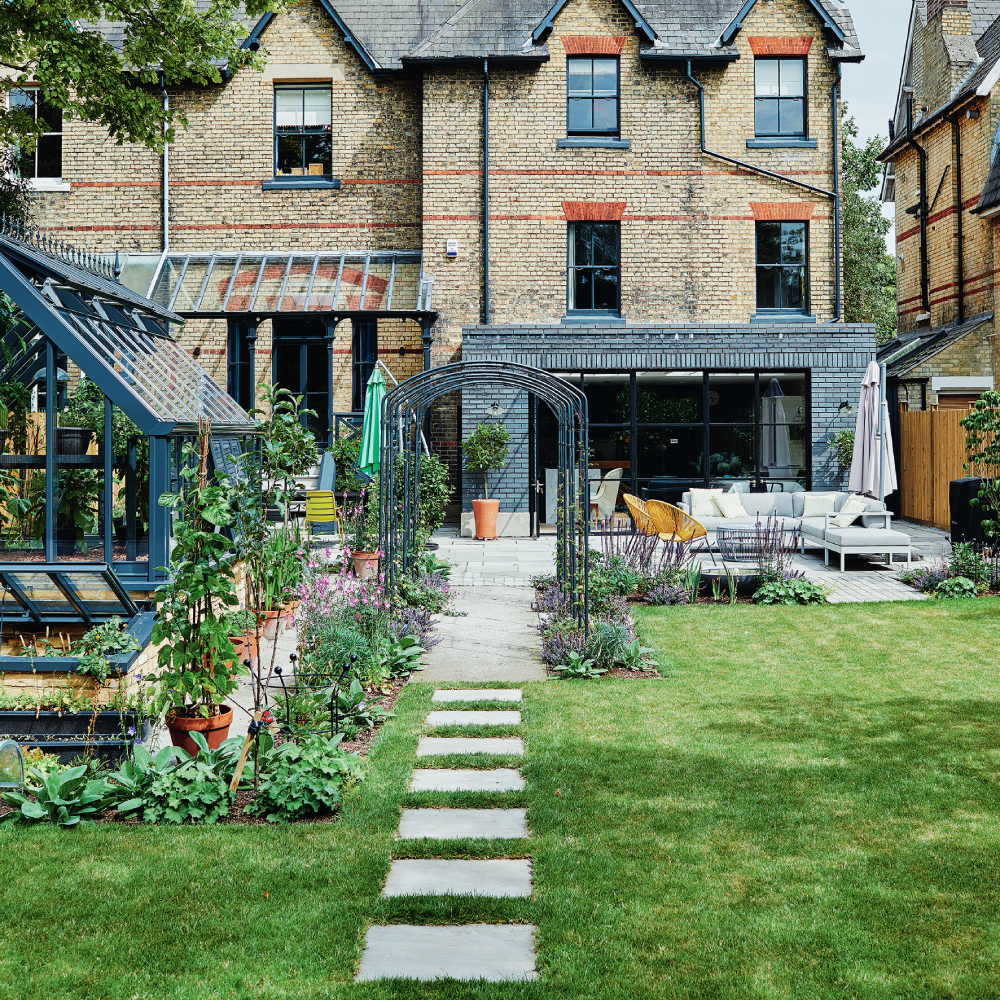 exterior of house with green lawn and pathway