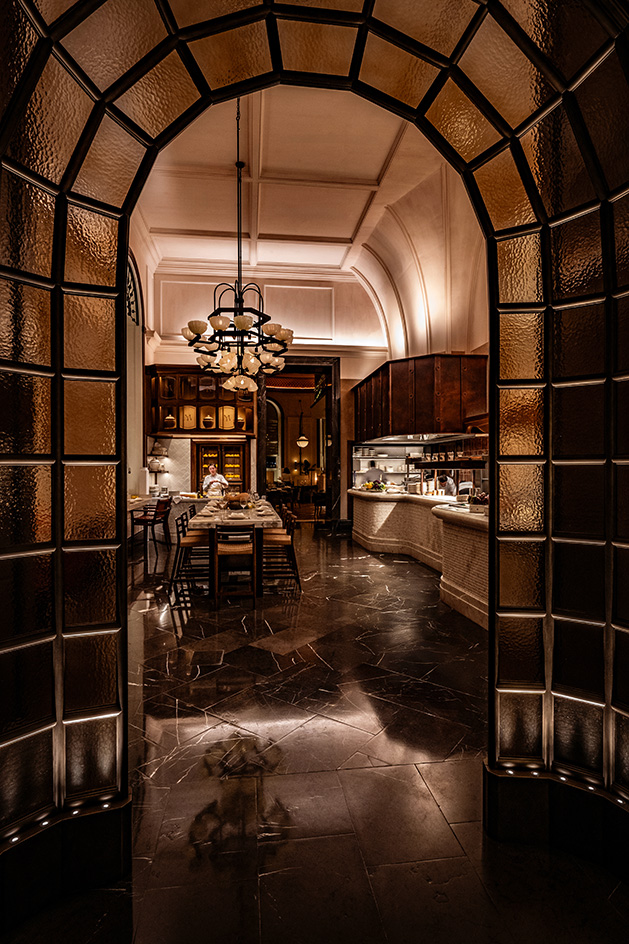 interior of Mezzogiorno by Afroditi in moody light and warm red and brown tones