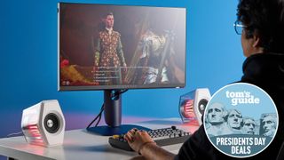 Person playing on Alienware AW2525HM monitor with Tom's Guide Presidents Day deals badge