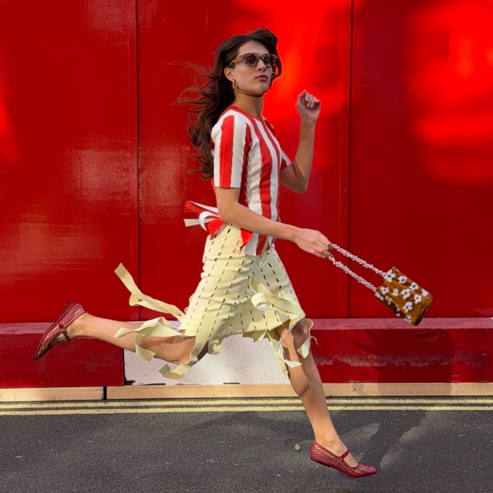 katyaklema wears a red striped top, yellow skirt and red ballet flats