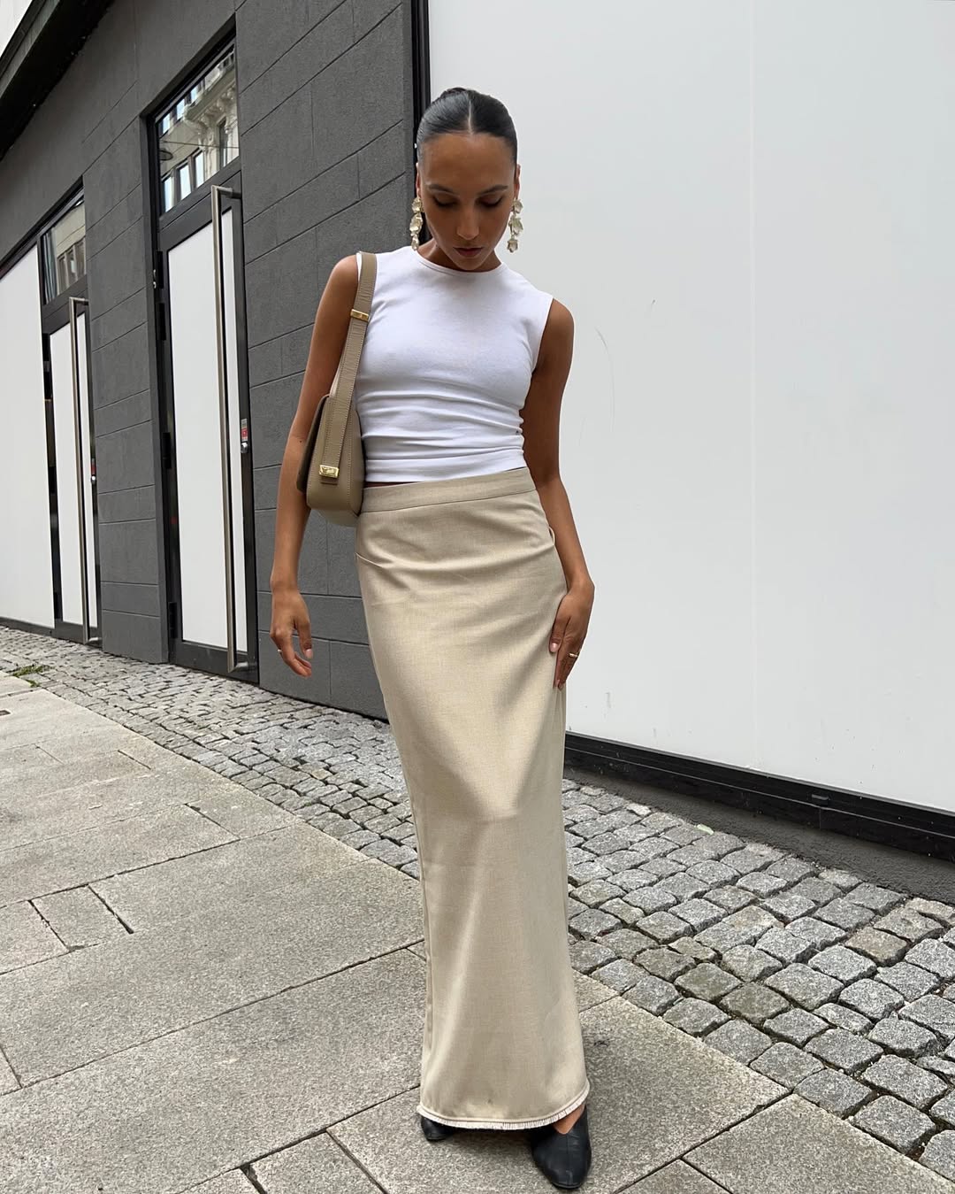 Woman wearing camel colored clothing summer 2025