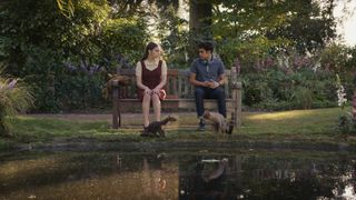 Lyra (Dafne Keen) and Will (Amir Wilson) sitting on a bench together