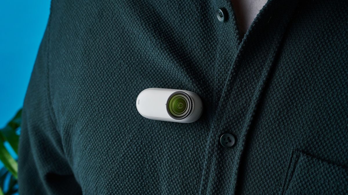 A photo of the Insta360 Go 3S affixed onto a shirt using the magnetic neck pendant. The pendant is behind the shirt so is not visible.