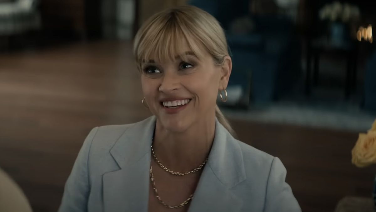 Margot (Reese Witherspoon) smiles at Jim in You&#039;re Cordially Invited