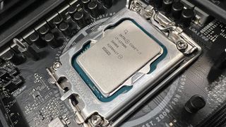 An Intel Core i7-13700K inserted into a motherboard