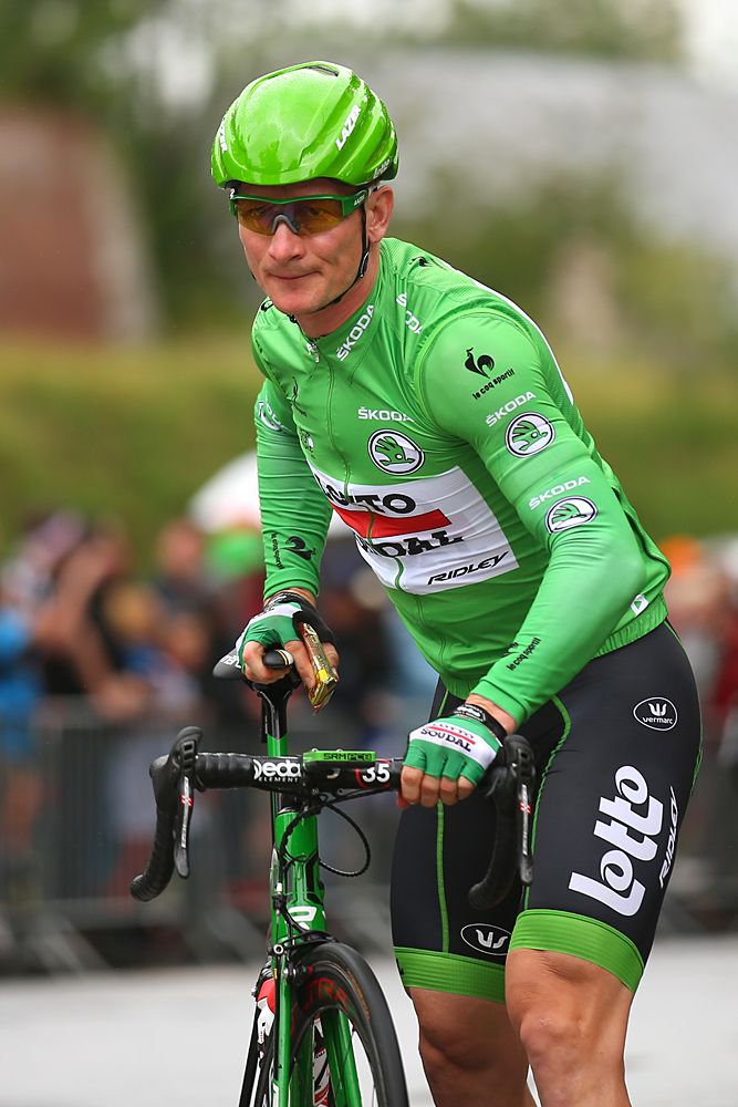 Andre Greipel heads to the start in the green jersey
