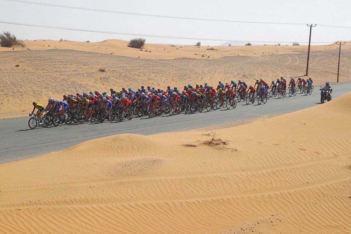 The peloton rides through the desert