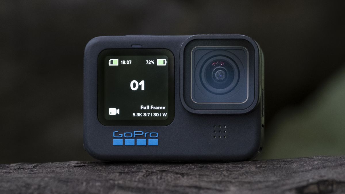 The GoPro Hero 11 Black action camera sitting on a wooden platform