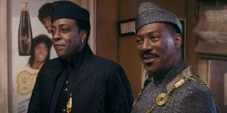 Semmi (Arsenio Hall) and Akeem (Eddie Murphy) smile in My-T Sharp Barbershop in Coming 2 America (2021)