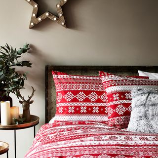 red and white christmas bedding set paired with grey wall