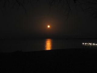 Skywatcher Peg Yates caught this view of the full moon of March 19, 2011 rising over the Potomac River from the northern neck of Virginia.