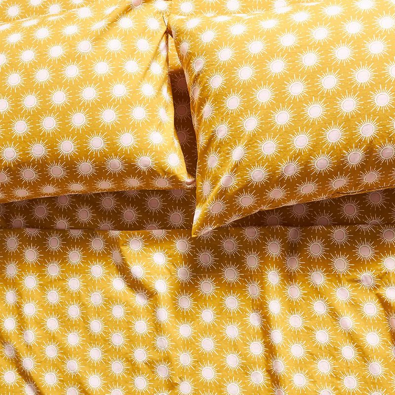 yellow and white patterned bedding