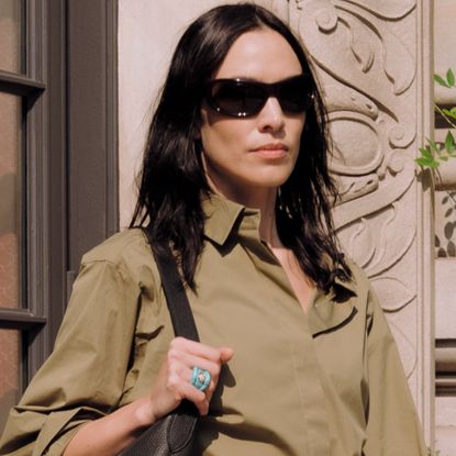 Alexa Chung wore the Bermuda shorts trend in olive green with peep-toe pumps