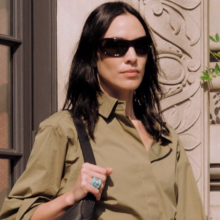 Alexa Chung wore the Bermuda shorts trend in olive green with peep-toe pumps