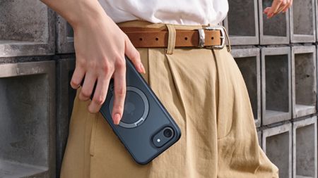 Torras Ostand for iPhone 16e case being held in hand