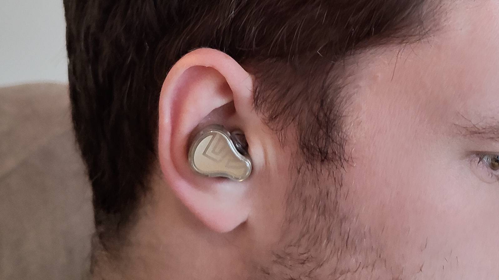 The Soundpeats H3 in a man&#039;s ear.