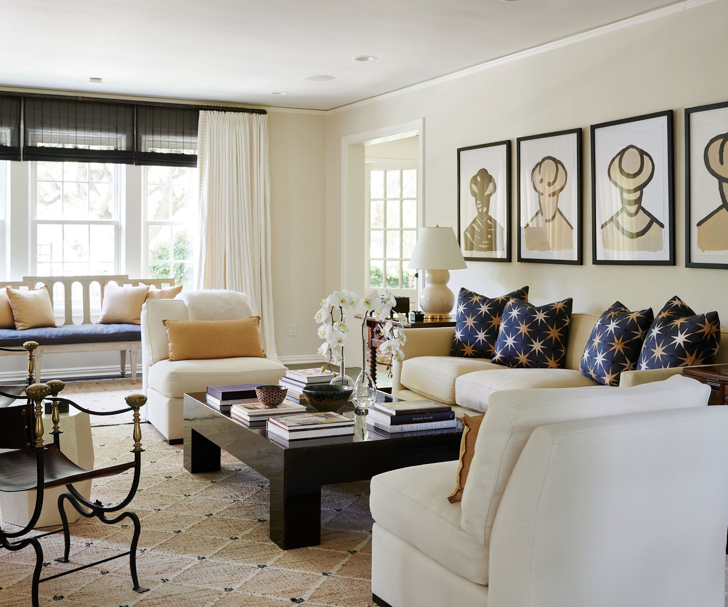 living room with blue sofas and beamed ceiling