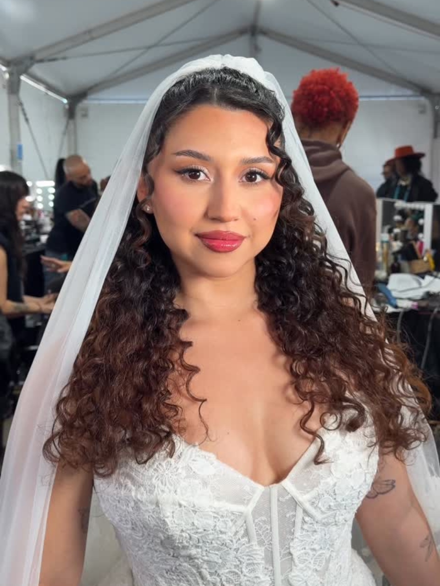 A bride featured in Bad Bunny's 2026 Super Bowl halftime show wears curls by Mariah Montes