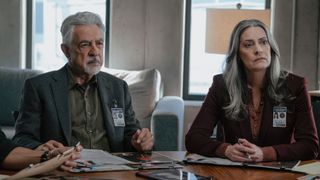 Rossi and Prentiss sitting at the table on Criminal Minds: Evolution.