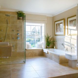 bathroom with shower area and bathtub and frame on wall