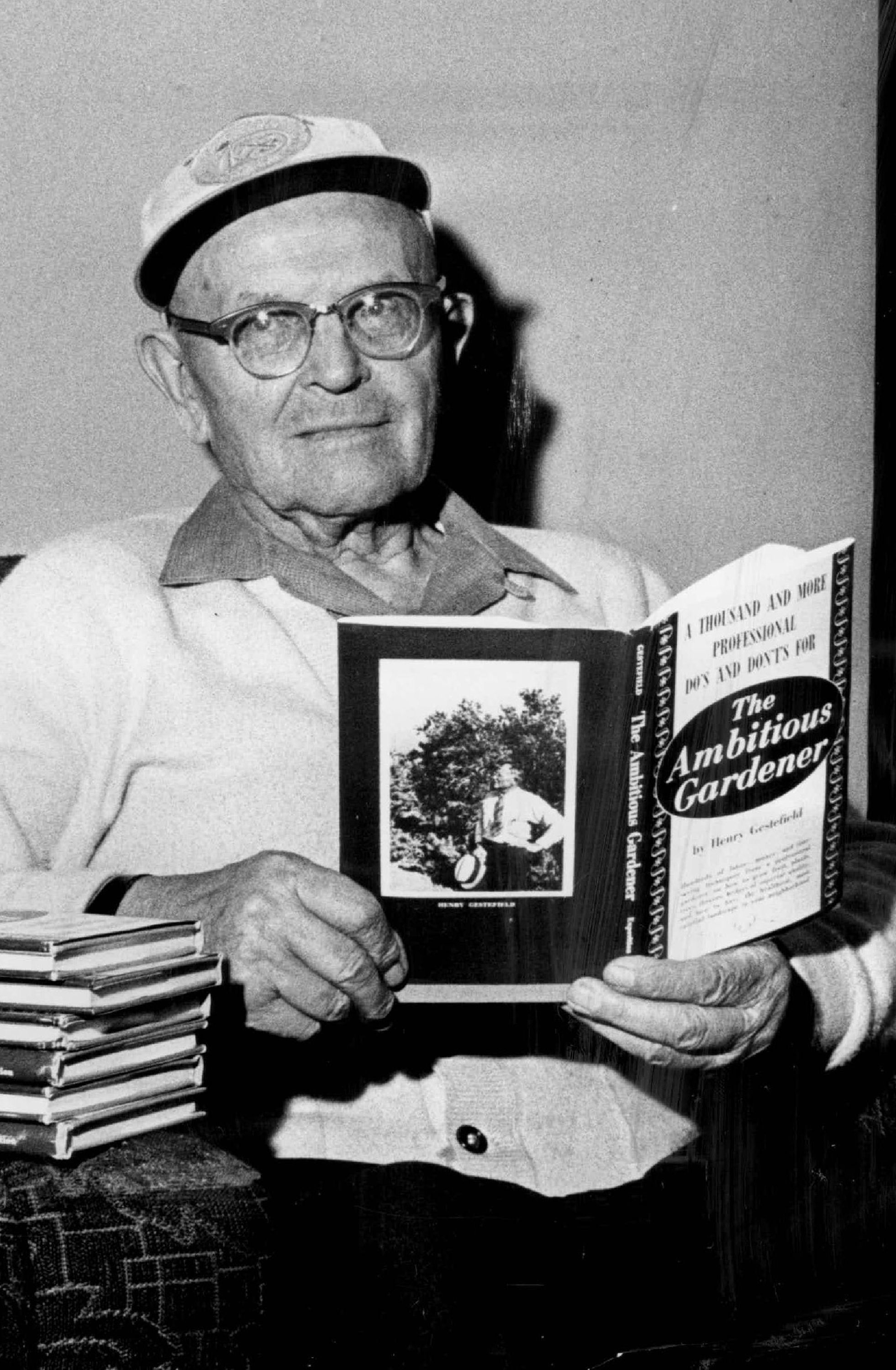 This photograph, taken in 1967, shows Henry Gestefield holding his gardening book which contains over sixty years of gardening know-how.