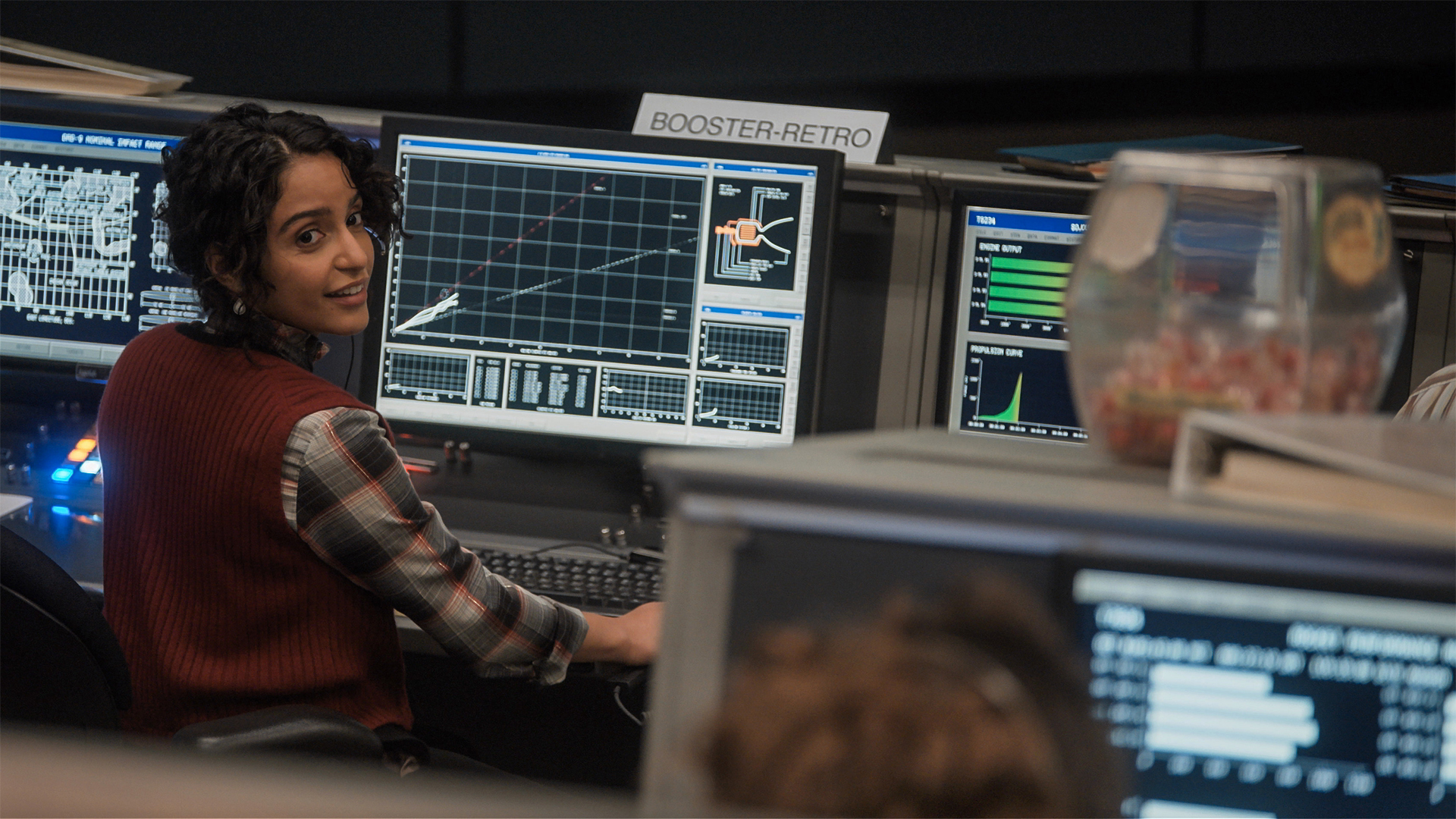 Aleida Rosales sits at a desk while working for NASA in For All Mankind