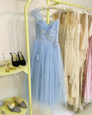 A vintage blue dress from the 1950s hangs at Happy Isles.