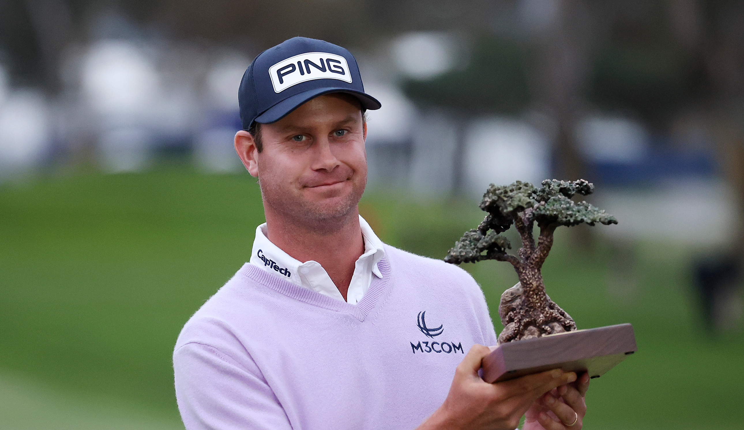 Harris English holds the Farmers Insurance Open trophy