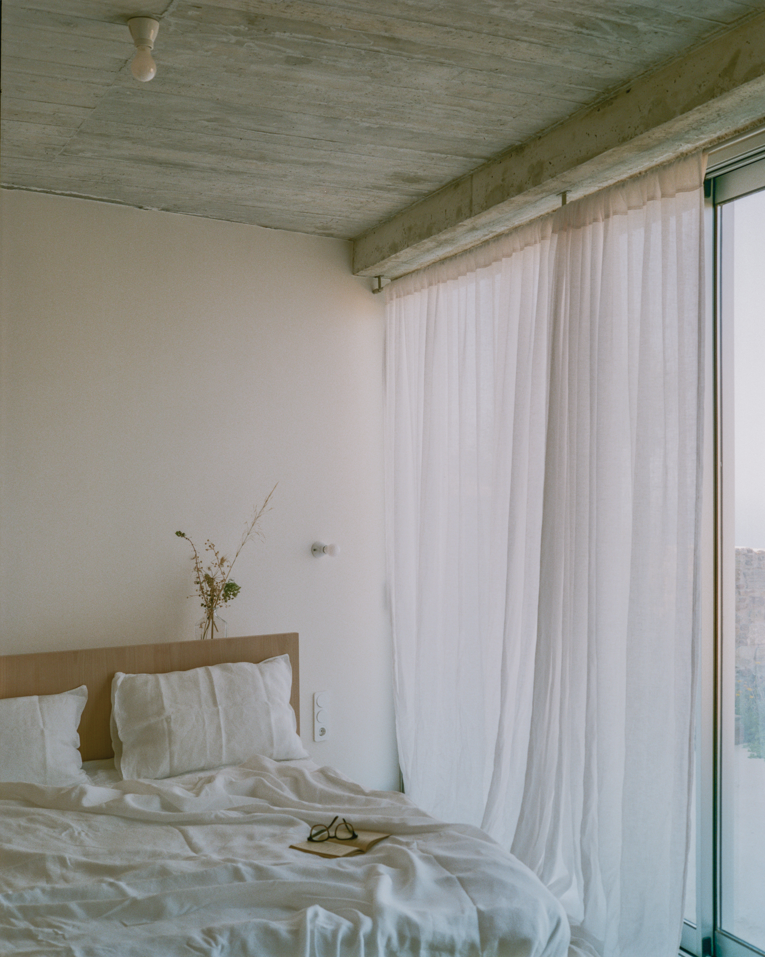 view of a Tinos house, using local vernacular such as stone walls and contemporary design