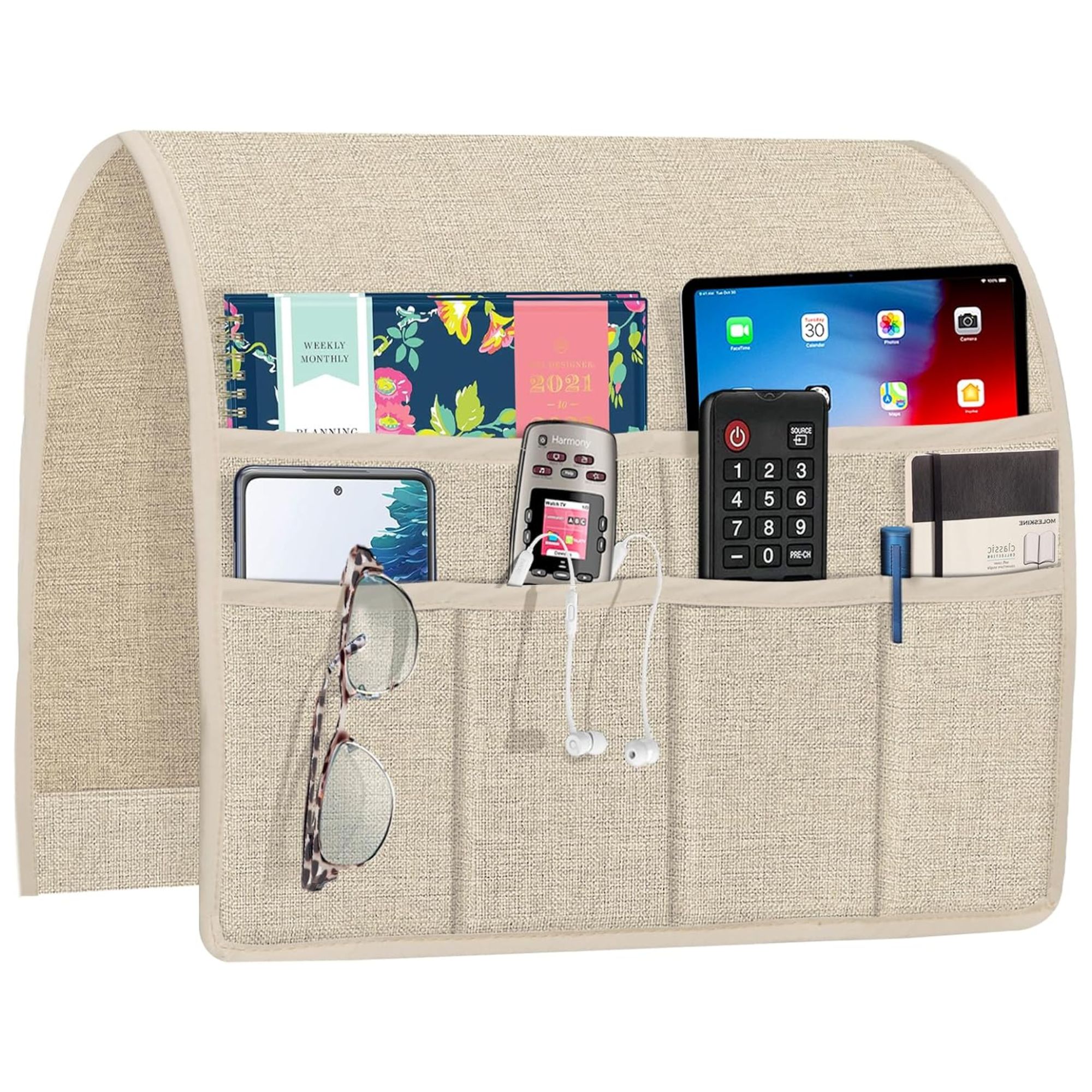 Armchair caddy filled with books, remotes, phones, glasses, notepad and pens.